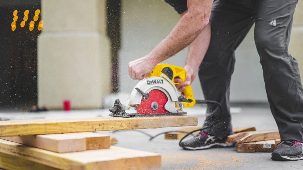 Construction Worker Sawing Wood