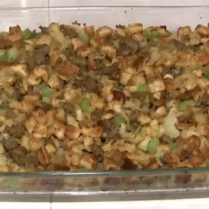 Cooked Bread and Sausage Dressing in Glass Baking Dish