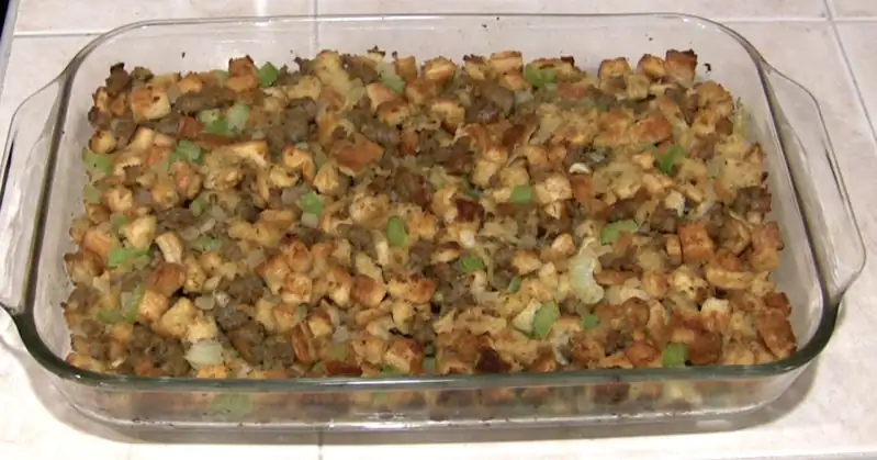 Cooked Bread and Sausage Dressing in Glass Baking Dish